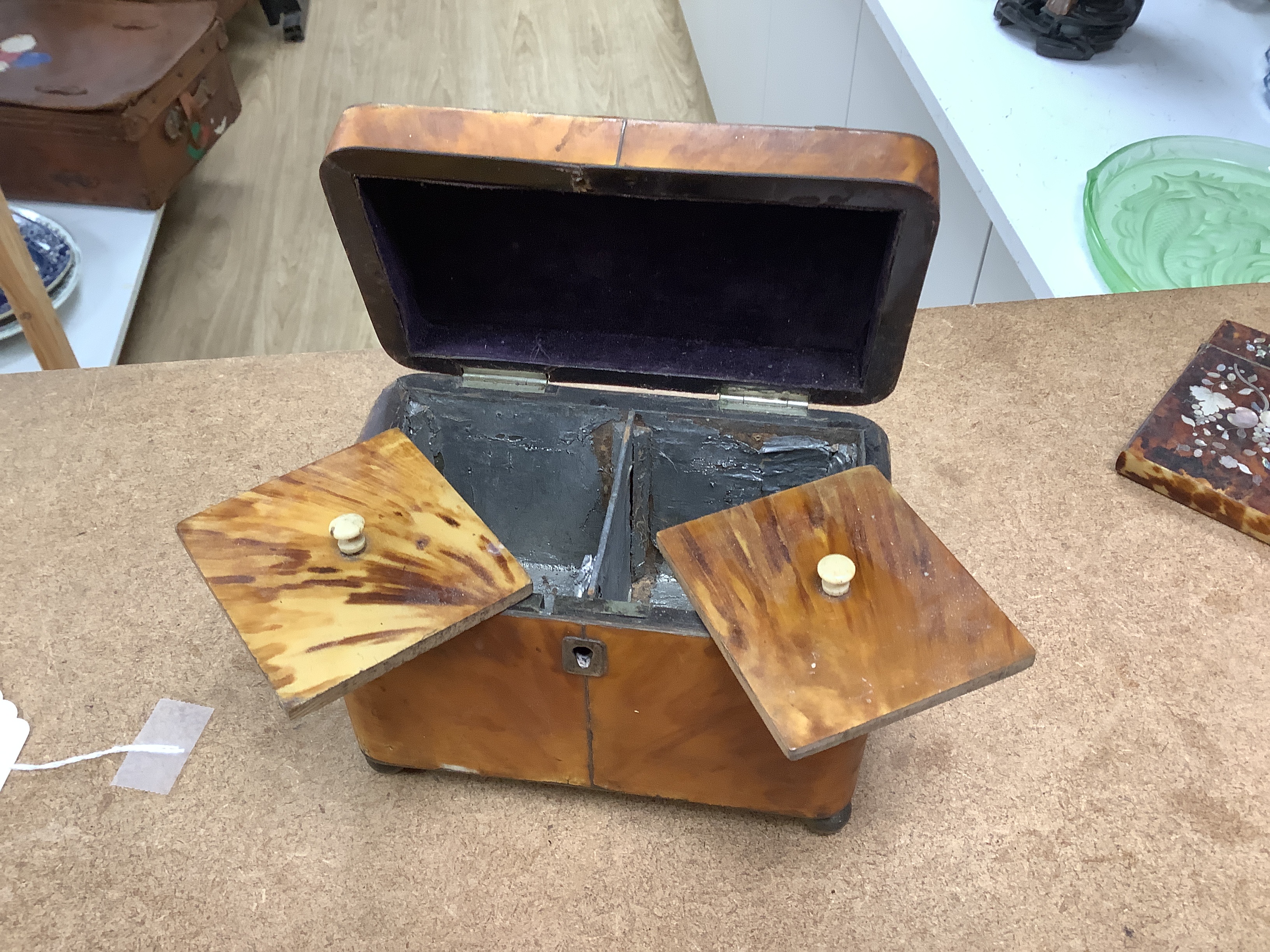 A 19th century two section tortoiseshell tea caddy on ball feet, a tortoiseshell necessaire case and a tortoiseshell and mother of pearl inlaid card case. tea caddy 15cm wide x 11cm high x 9cm deep CITES Submission refer